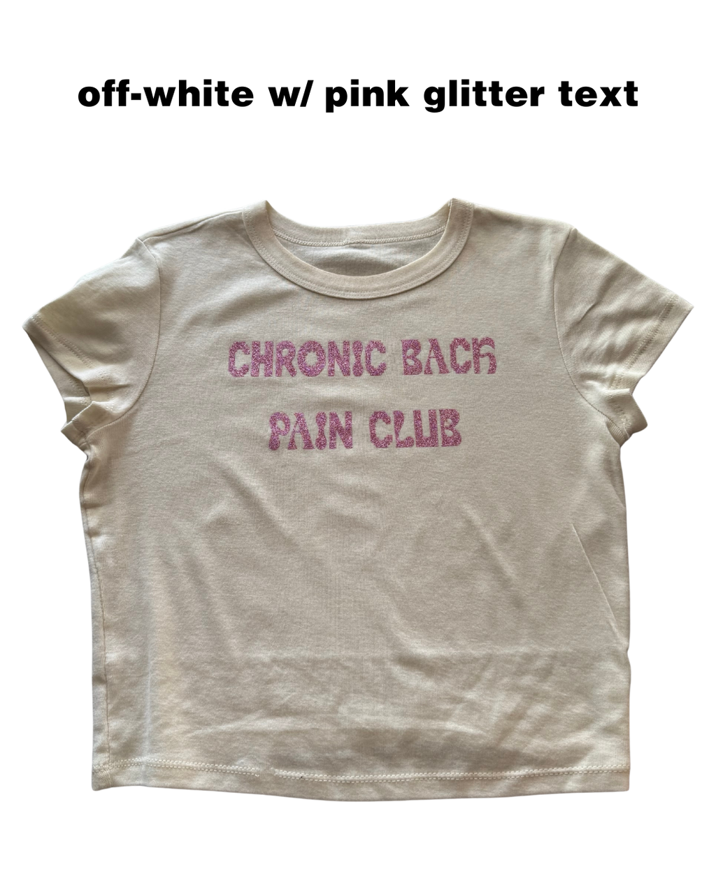 off-white t-shirt with pink glitter text 'CHRONIC BACK PAIN CLUB' on a white background