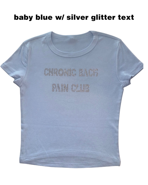 Light blue t-shirt with 'Chronic Back Pain Club' text in silver glitter on a white background.