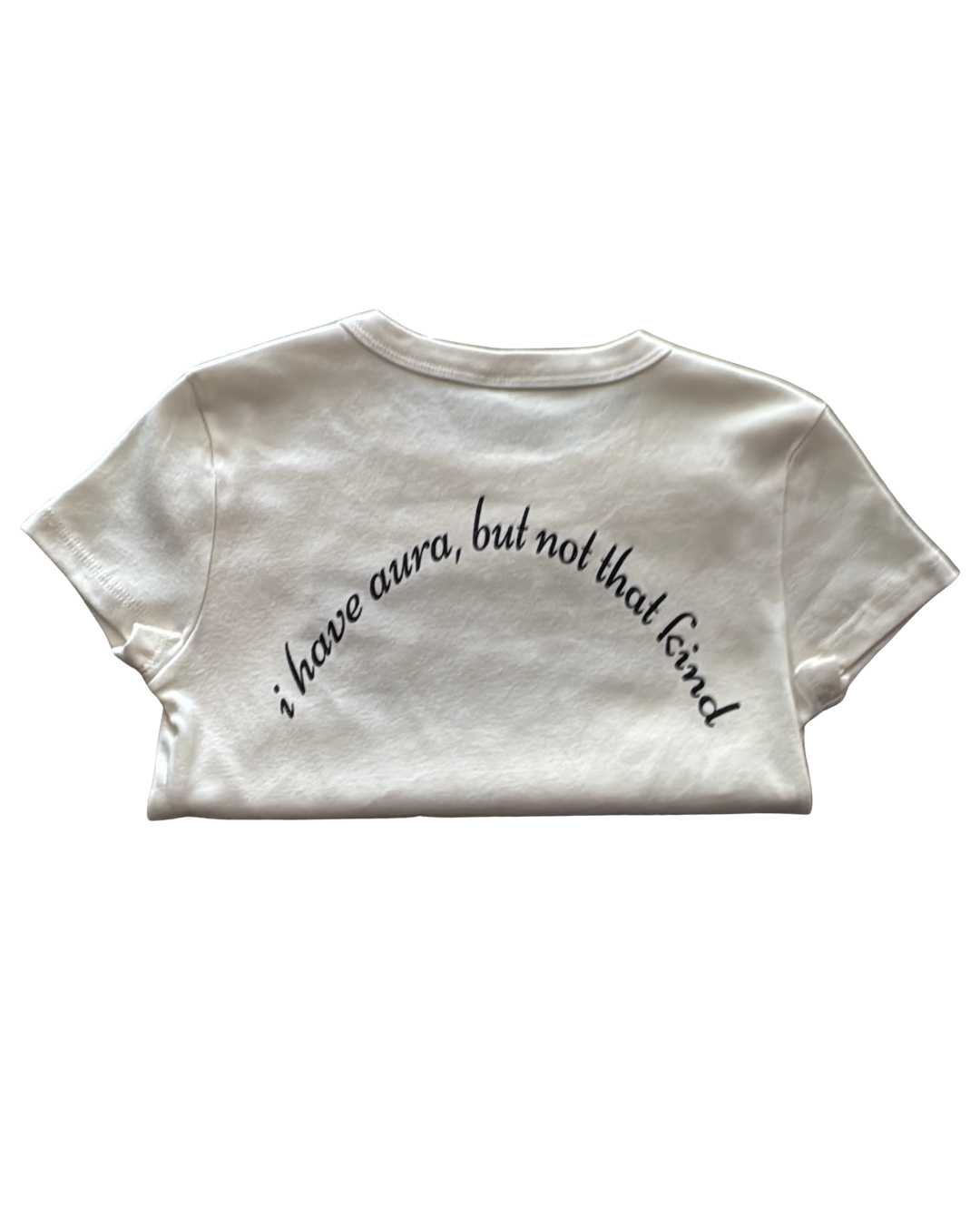 White t-shirt with black text "i have aura but not that kind" on a white background. 