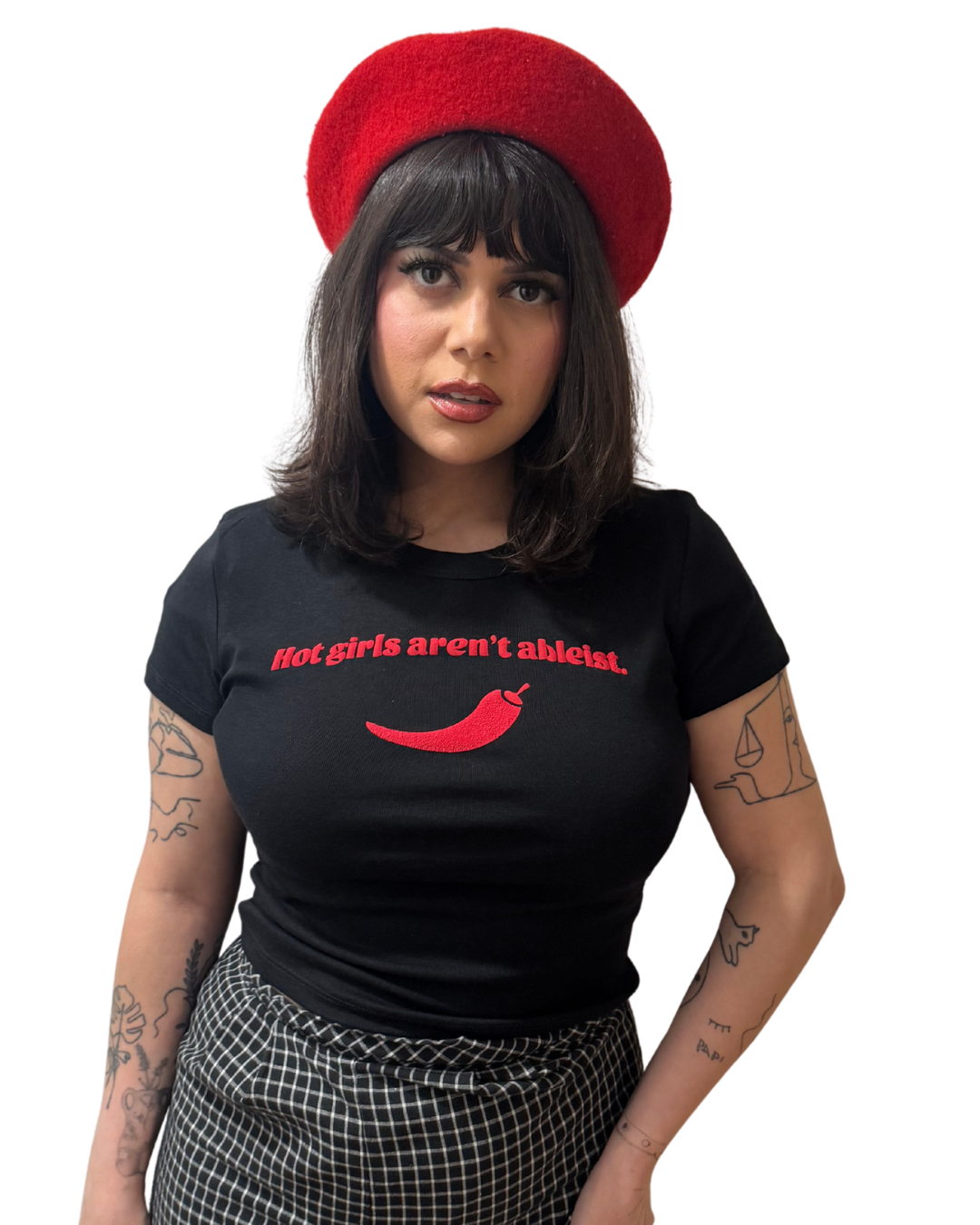 Person wearing a black t-shirt with red text and a red beret on a white background