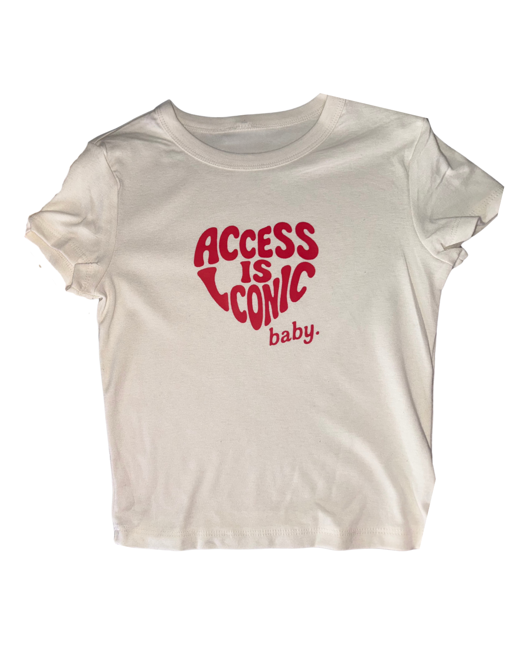 A close-up photo of  wearing a crop top stretchy t-shirt with the "Access Is Iconic Baby" design in red. It's in the center of the tshirt. 