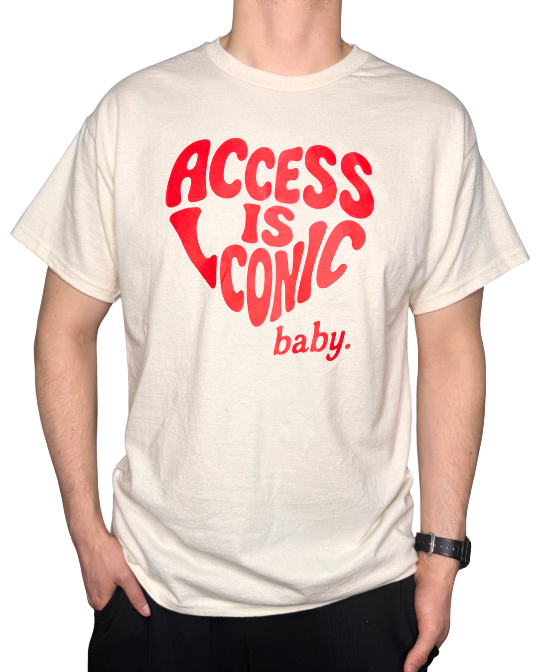 A close-up photo of a man wearing a regular length cotton t-shirt with the "Access Is Iconic Baby" design in red. It's in the center of the tshirt. 