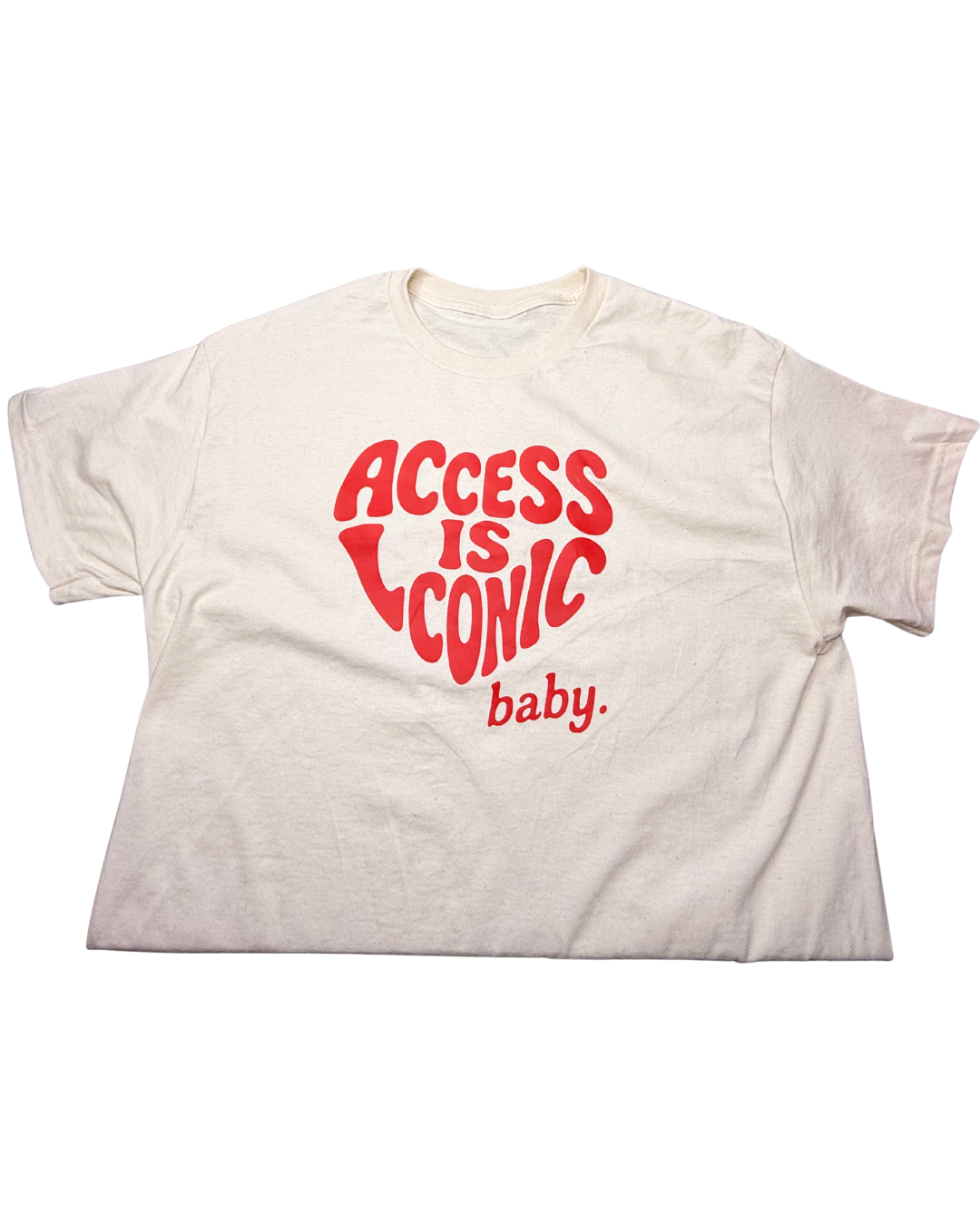 A close-up photo of  a regular length cotton t-shirt with the "Access Is Iconic Baby" design in red. It's in the center of the tshirt. 