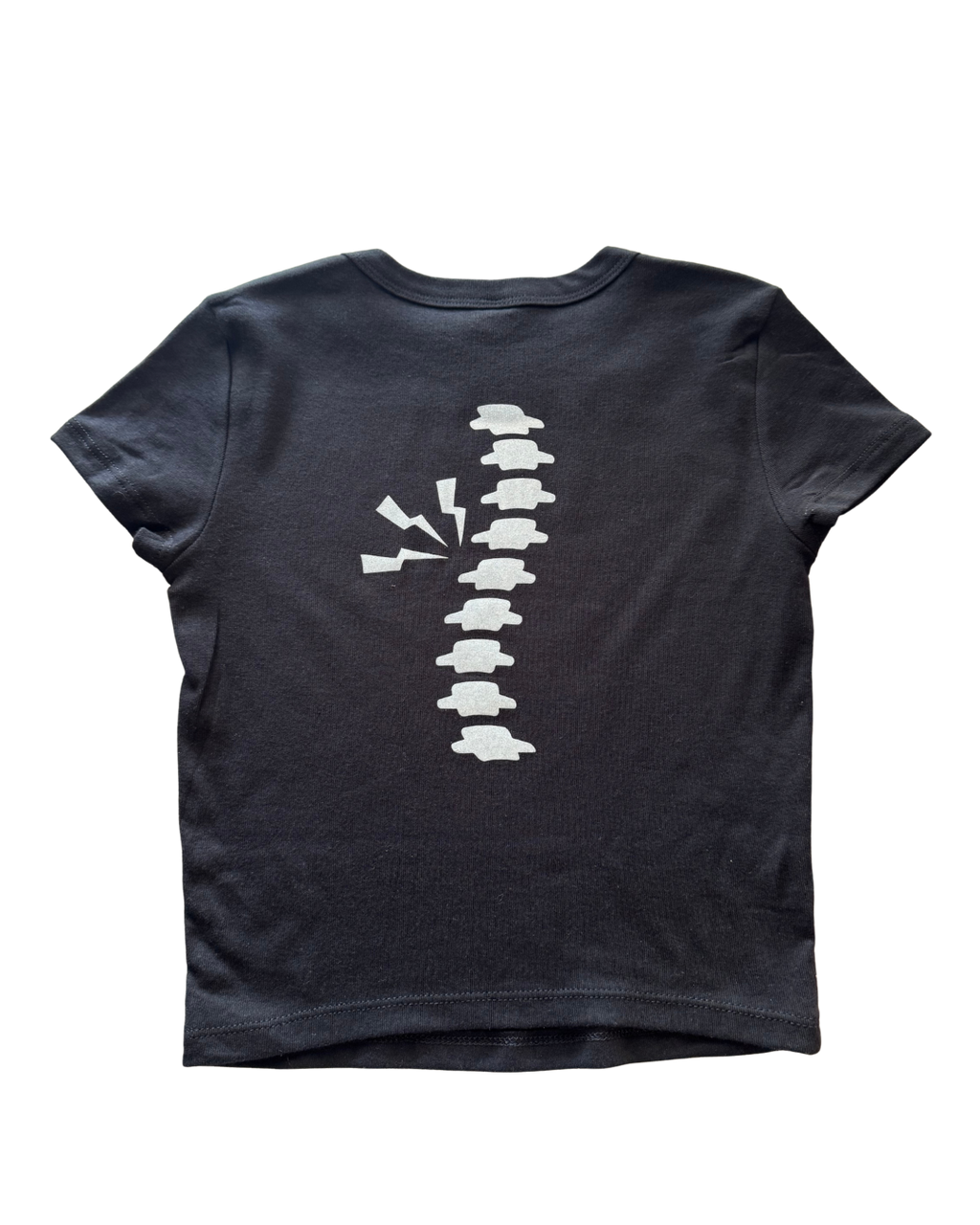 Black t-shirt with a glitter white spine graphic design on a white background
