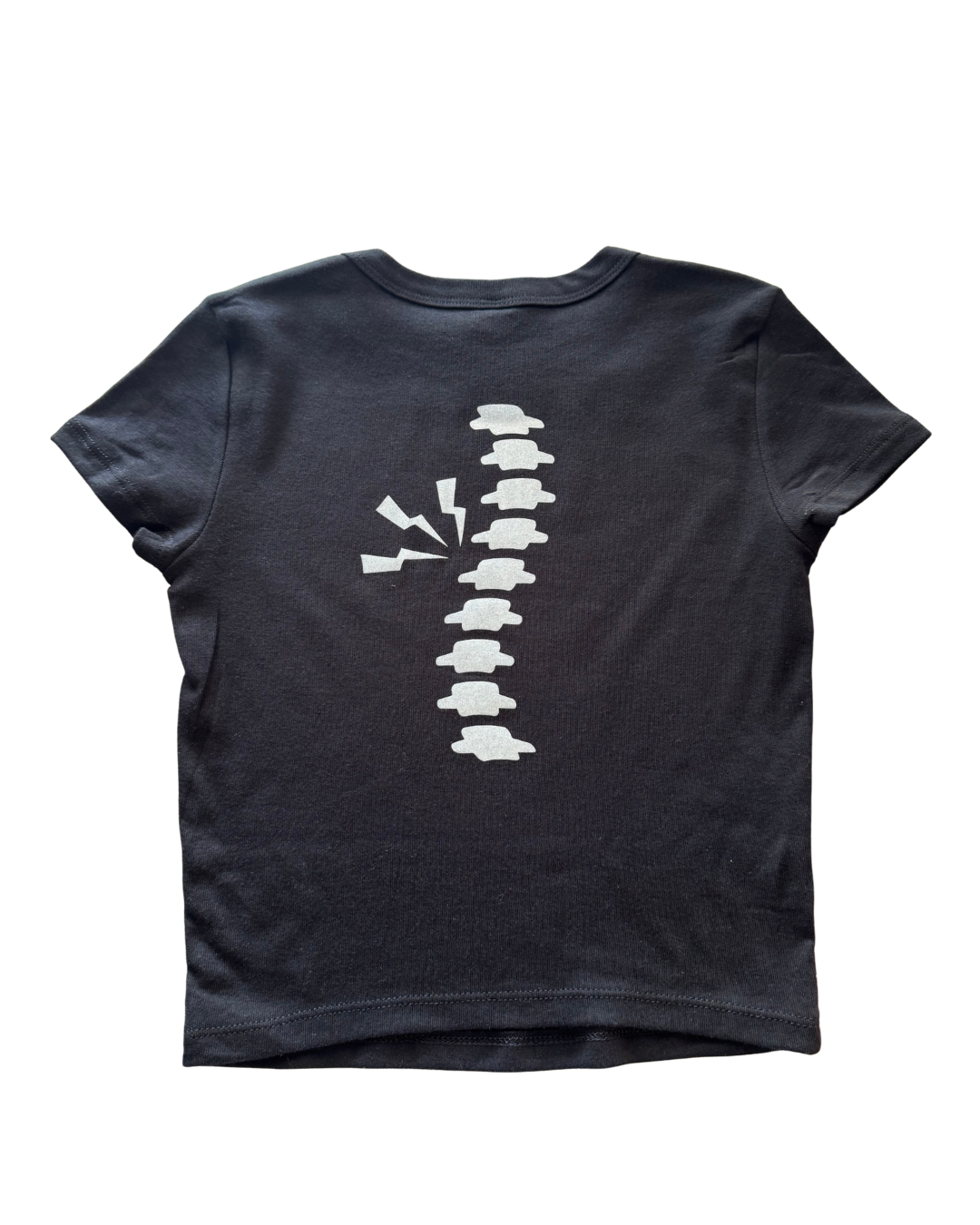 Black t-shirt with a glitter white spine graphic design on a white background