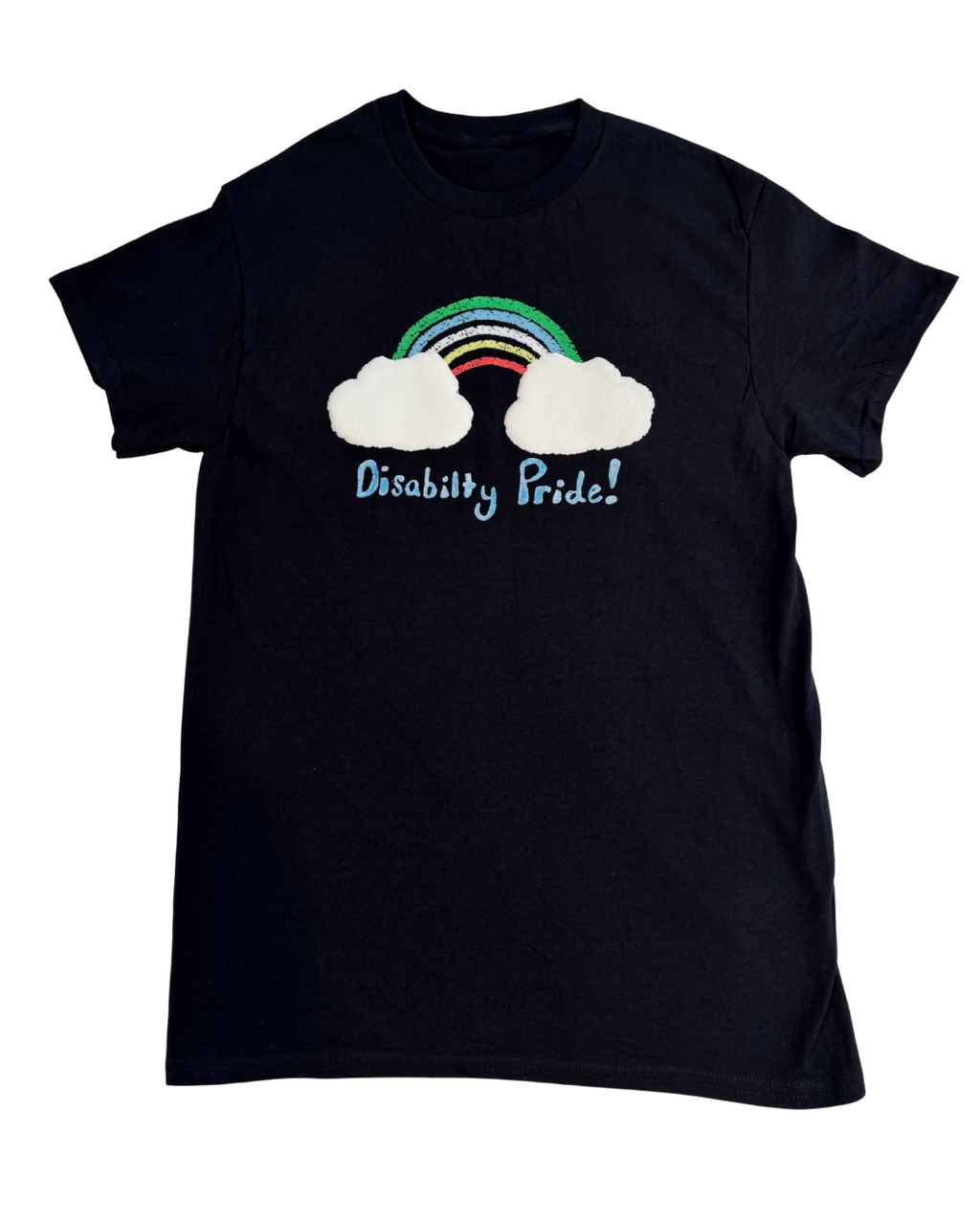 Black t-shirt with a rainbow and cloud design on a white background. Underneath, it says "disability pride!" in light blue handwriting.