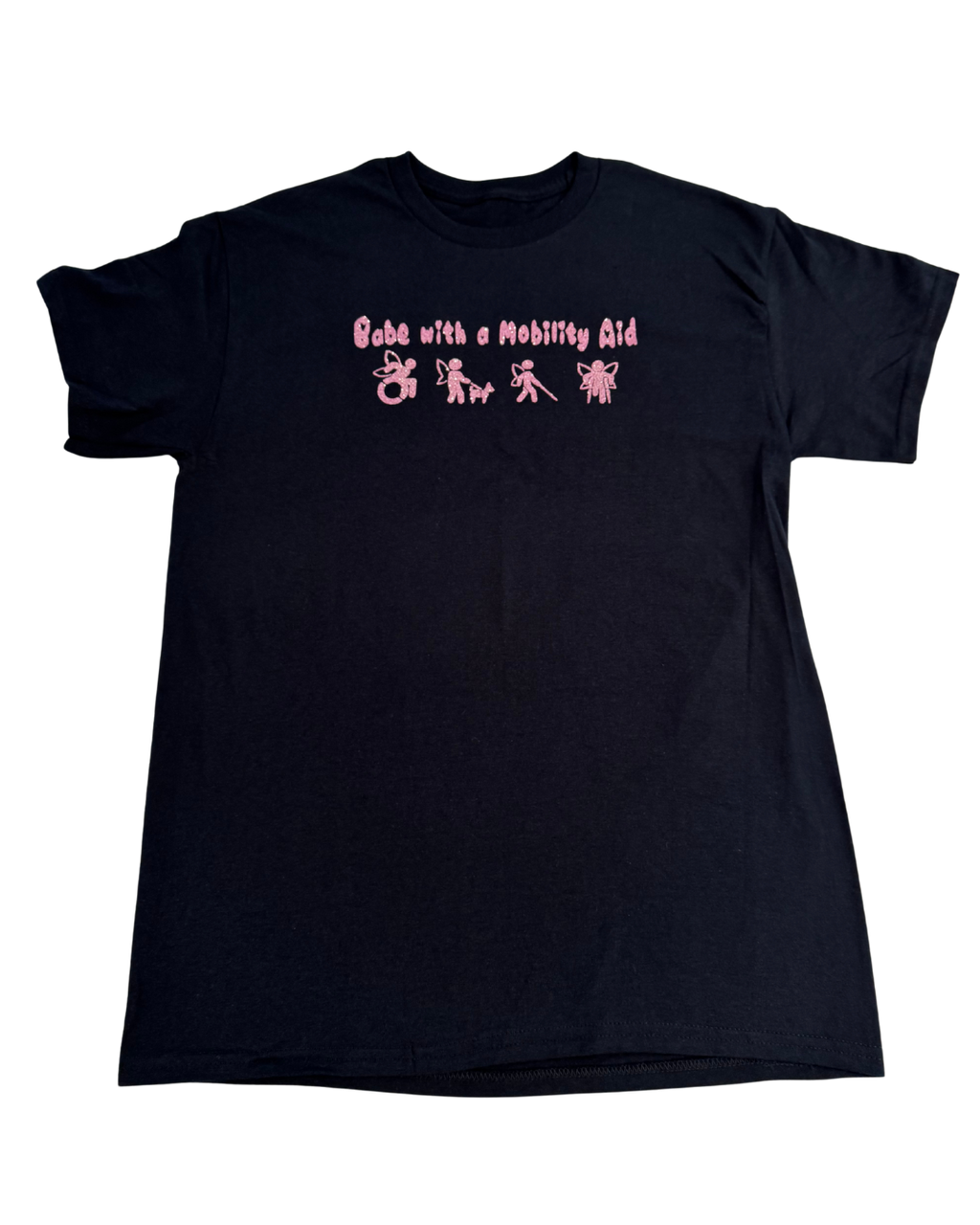 Black t-shirt with pink glitter text that says "Babe with a mobility aid" in bubble letter typography and disability symbols on a white background