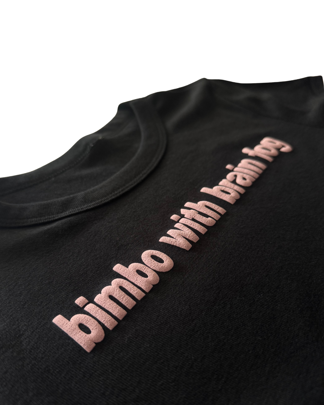 Black t-shirt with pink text 'bimbo with brain' on a white background