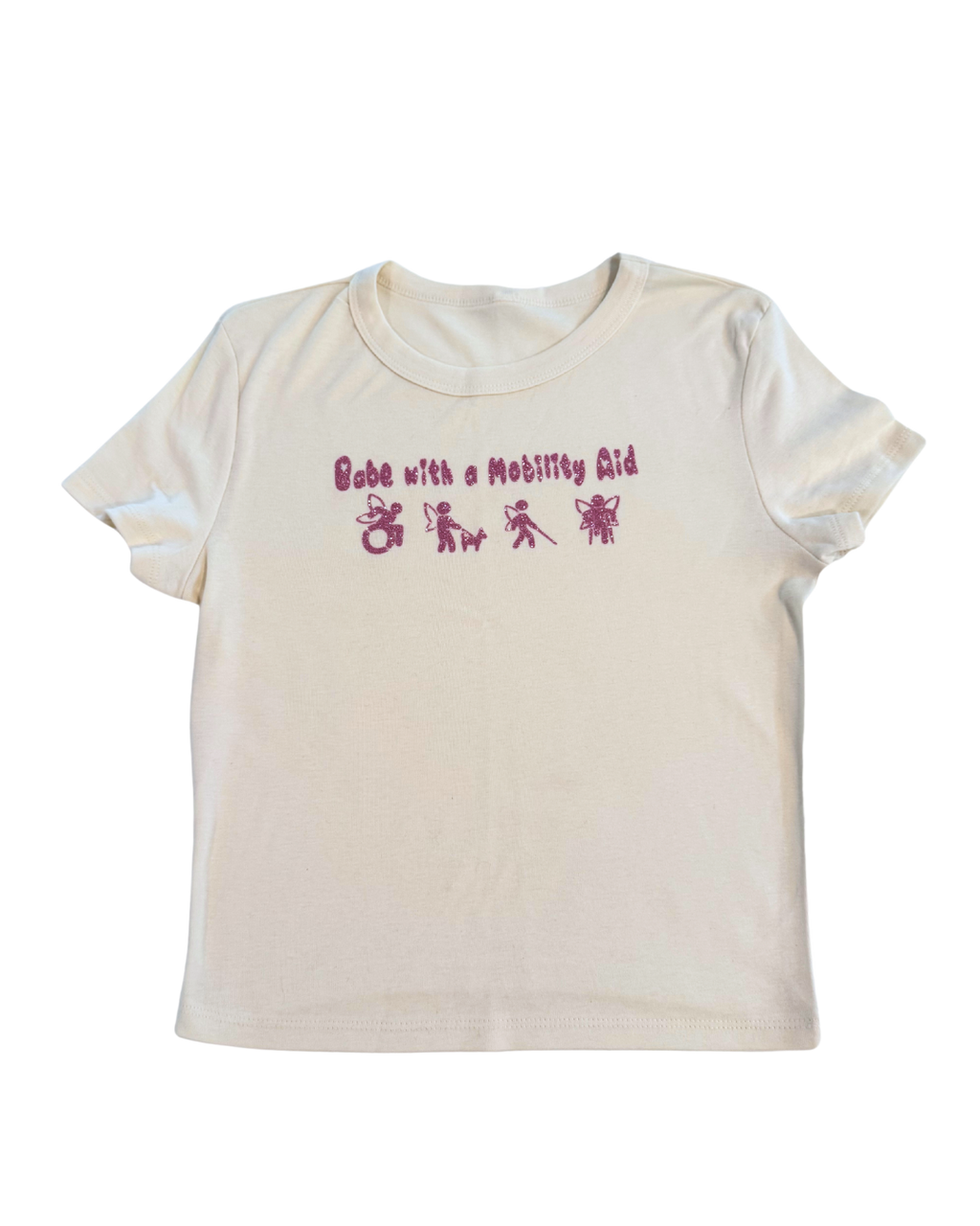off-white t-shirt with pink glitter text that says "Babe with a mobility aid" in bubble letter typography and disability symbols on a white background