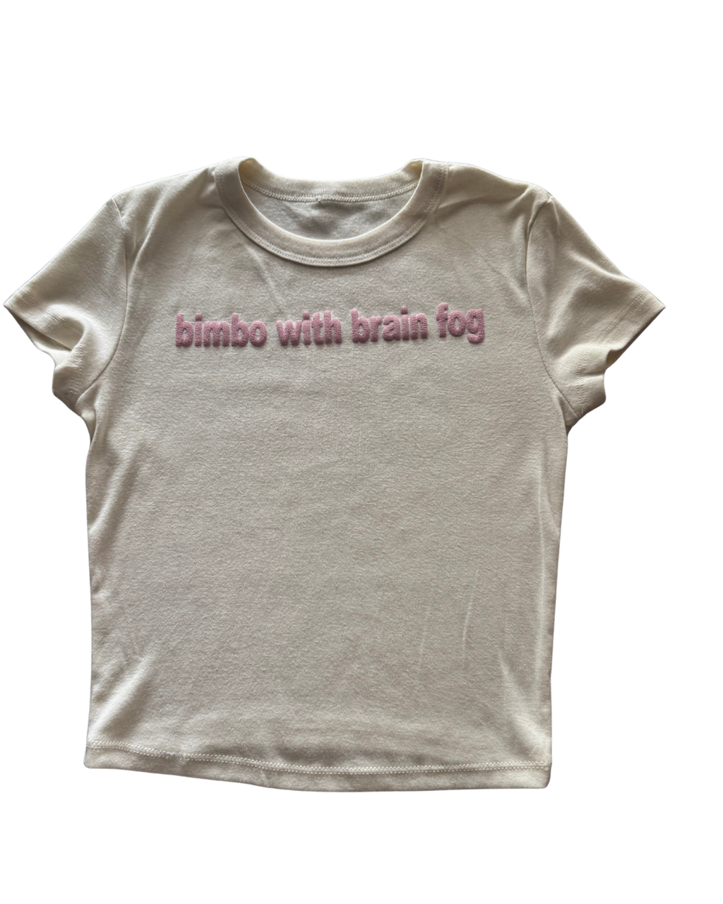 White t-shirt with pink text 'bimbo with brain fog' on a white background